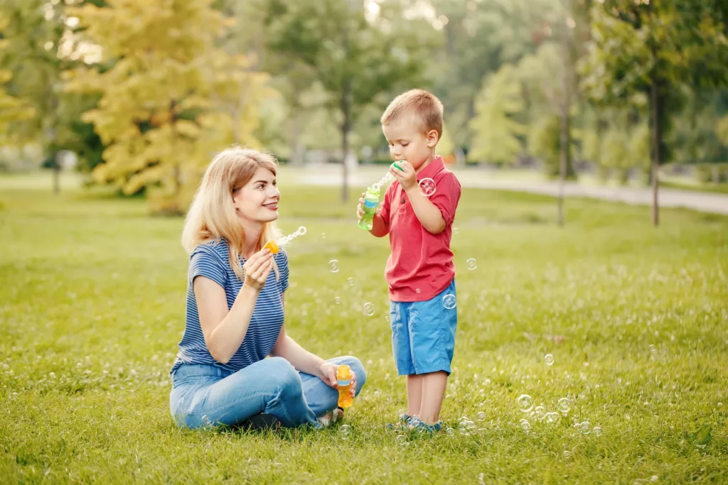 mother and son playing at the park